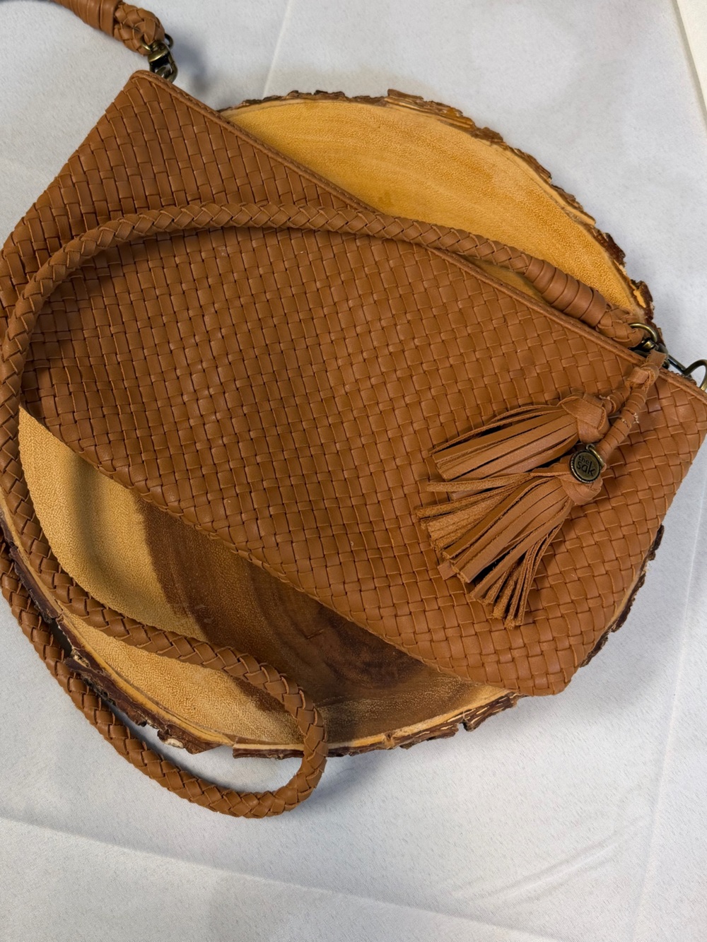 The SAK Woven Leather Crossbody Bag in Cognac Brown Tassels Detachable Strap